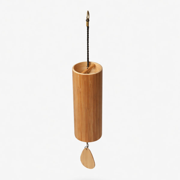 Bamboo hanging Koshi windchime with a leaf-shaped wooden pendant on a white studio background