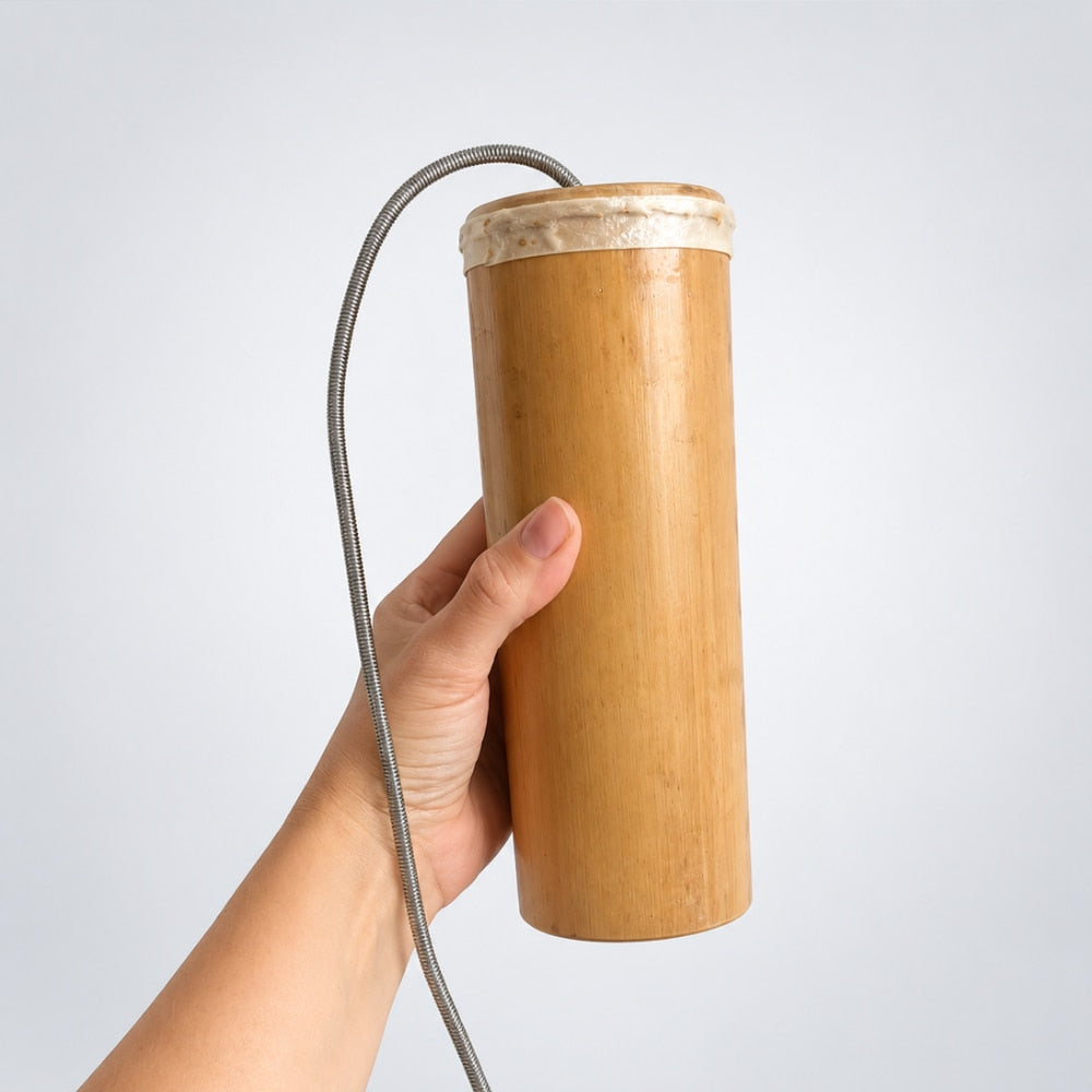 hand holding bamboo thunder drum