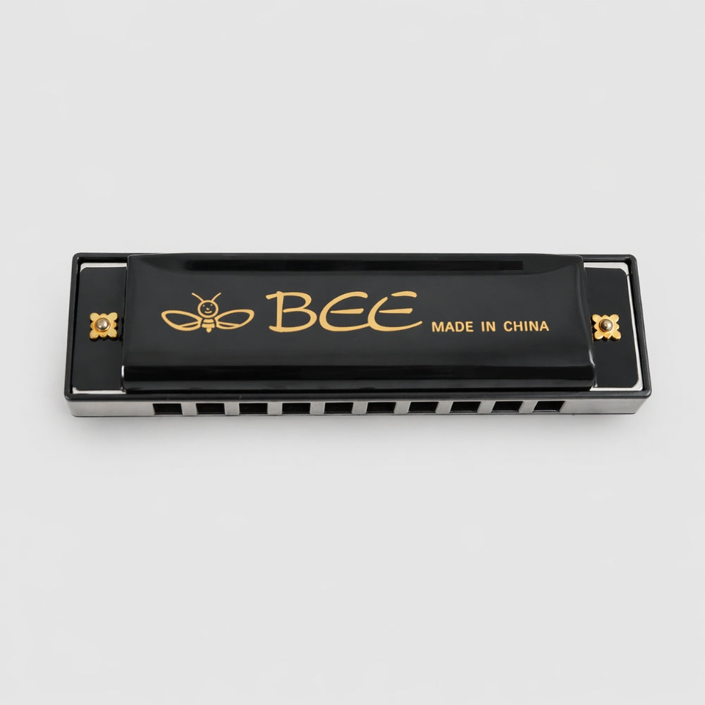 Black harmonica with 'BEE' branding on a white background