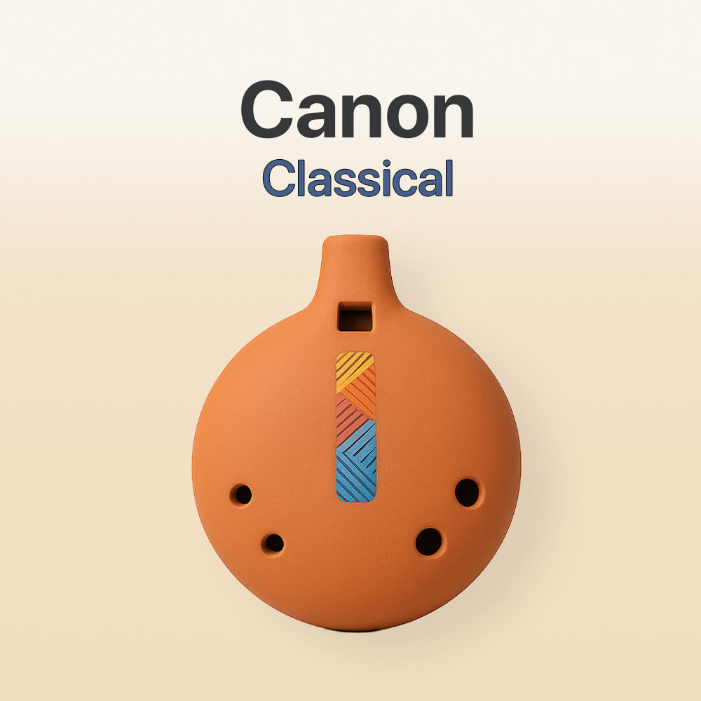 Ceramic ocarina with geometric design on a beige background, featuring the brand 'Canon'.