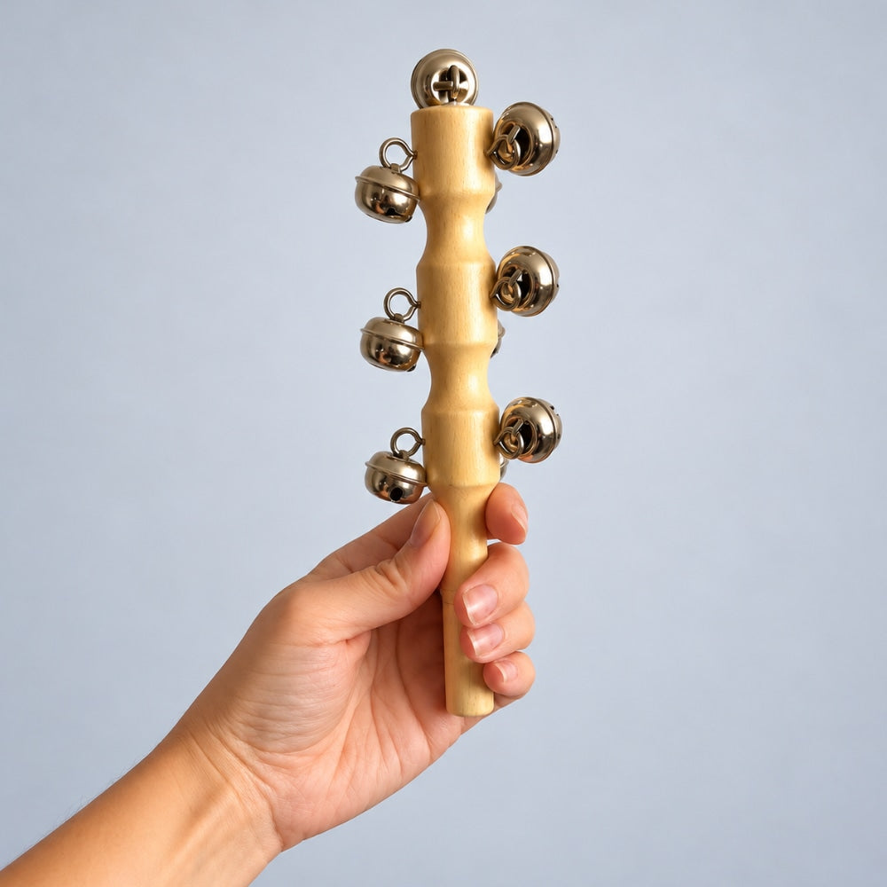 hand holding bell shaker