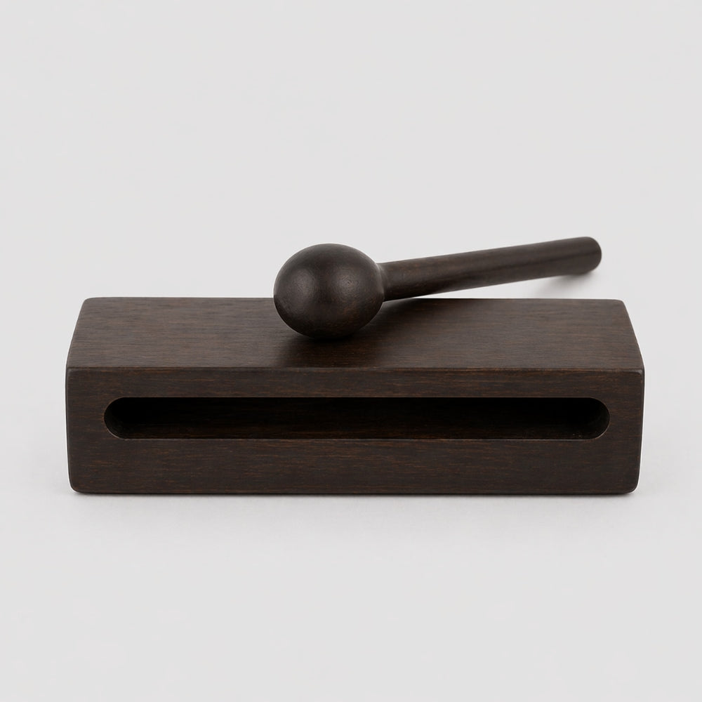 Wooden mallet and block on a white background