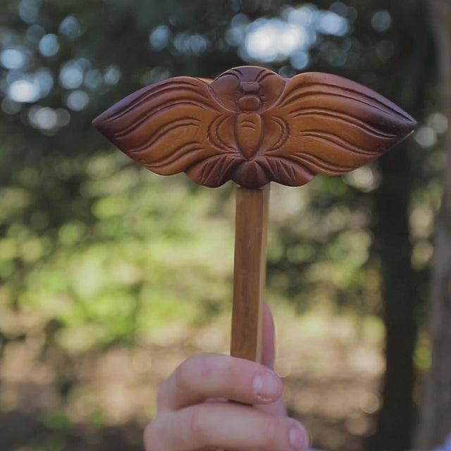 A video of the Cricket Clapper being played outdoors, demonstrating the sound it produces in a natural setting.